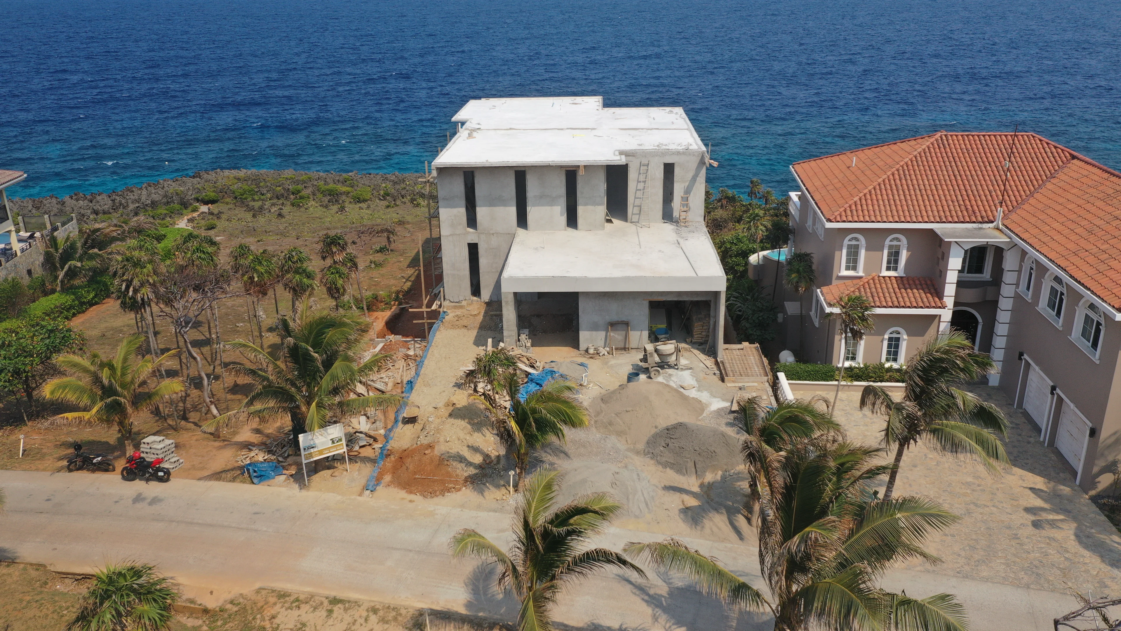 Arched colonnade and balconies of a custom-built Lighthouse Estates home.